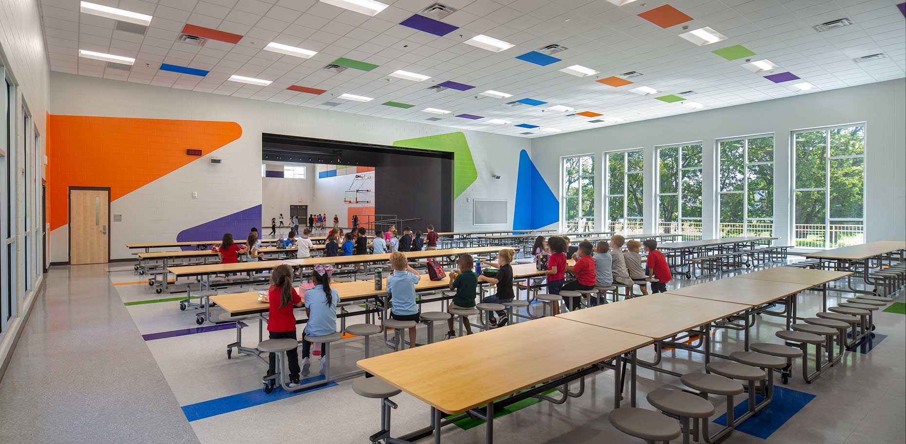 A view showing students having lunch in the interior of the cafeteria/multi-purpose room in Goodlettsville Elementary School