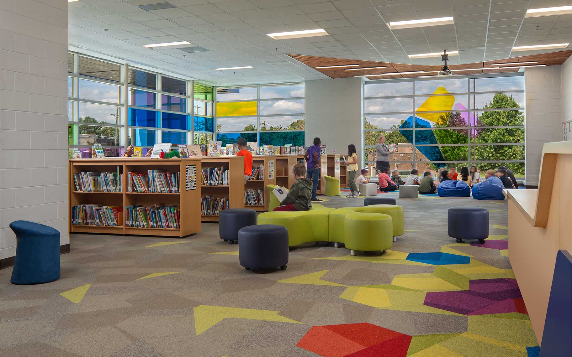 An interior view of the Media Center at Goodlettsville Elementary School, with students enjoying stories and looking for books