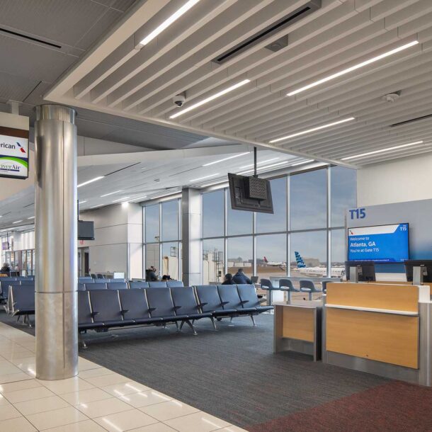 An interior view of Gate 15 on the T Concourse at Hartsfield Jackson Atlanta International Airport showing airplanes taxiing outside