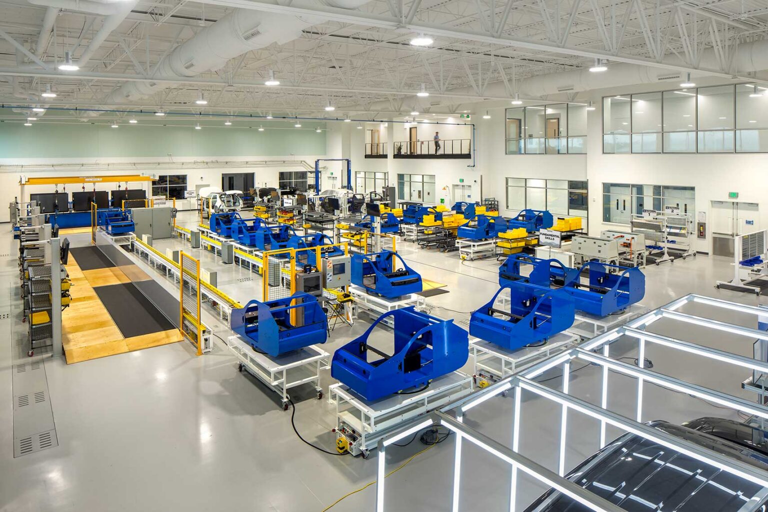 A high-bay space of the Quick Start - Hyundai Mobility Training Center of Georgia with an automated assembly line for training employees