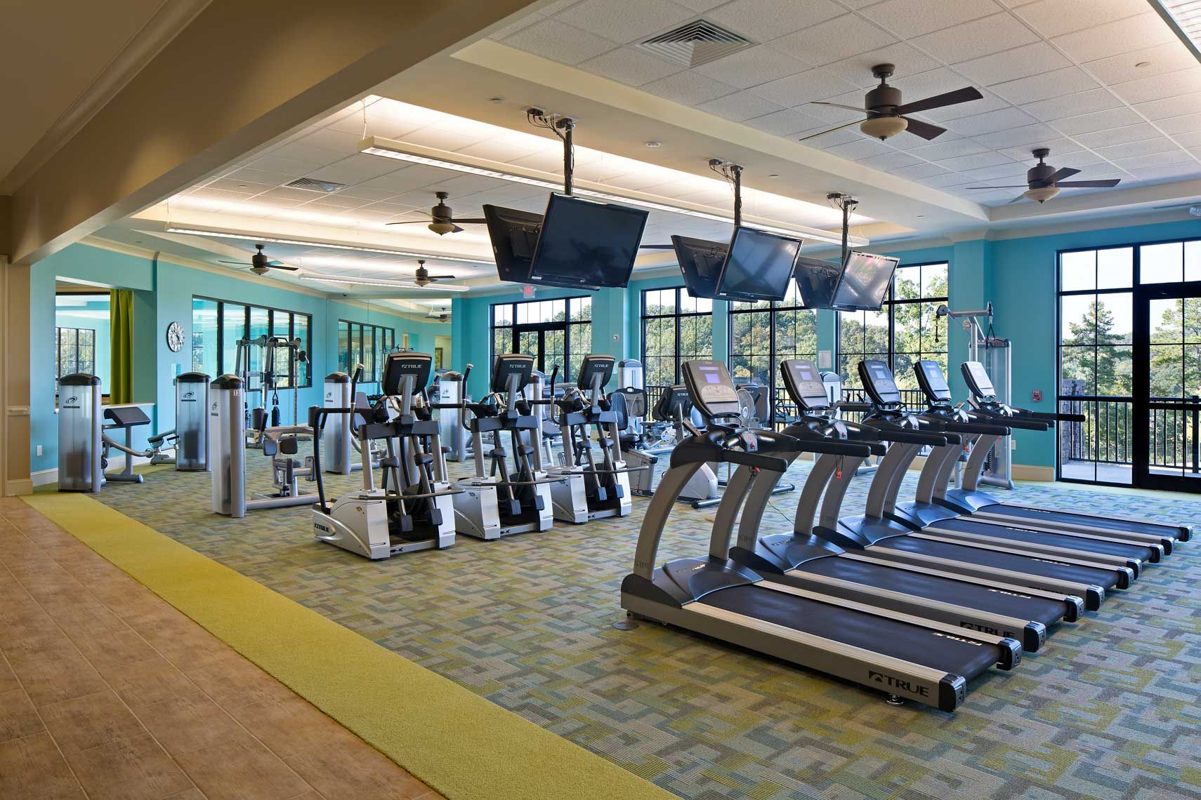 The fitness center at Cresswind at Lake Lanier featuring cardio and weightlifting equipment