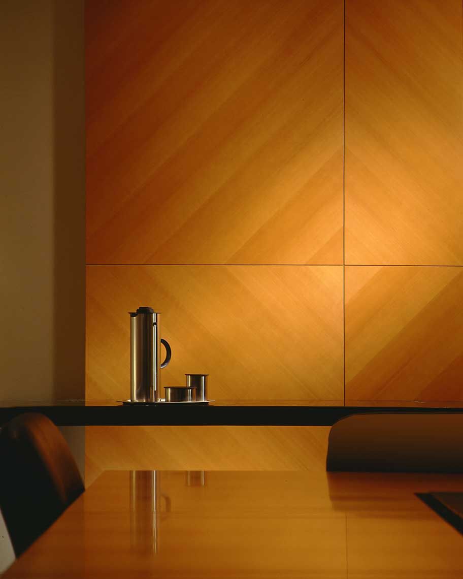 Interior detailed view of a wooden conference table at Deloitte & Touche