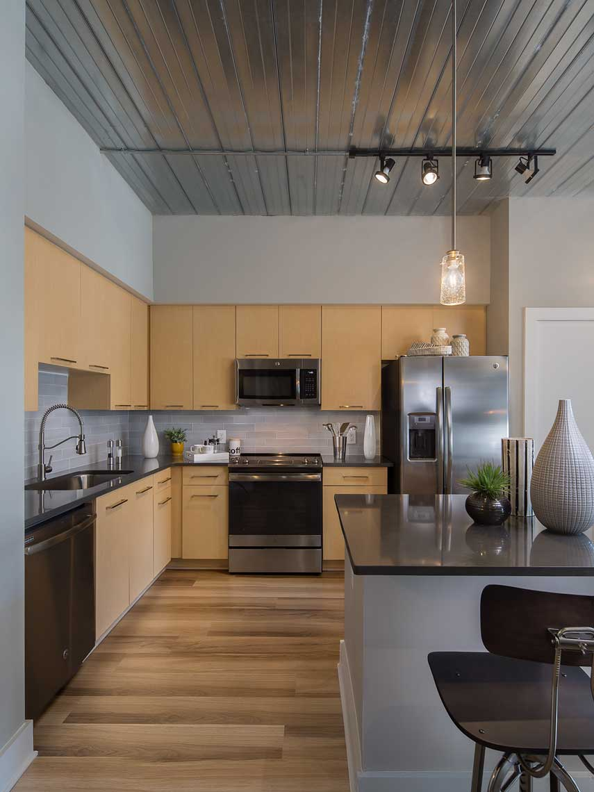 A view of the simple and elegant model unit kitchen at the Goodwynn at Town Brookhaven