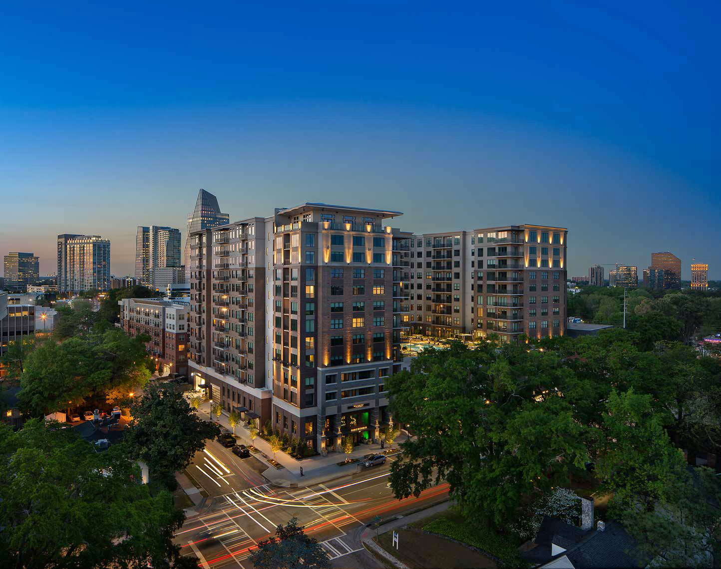 An expansive view of the majestic Ashley Gables Buckhead apartment community at twilight