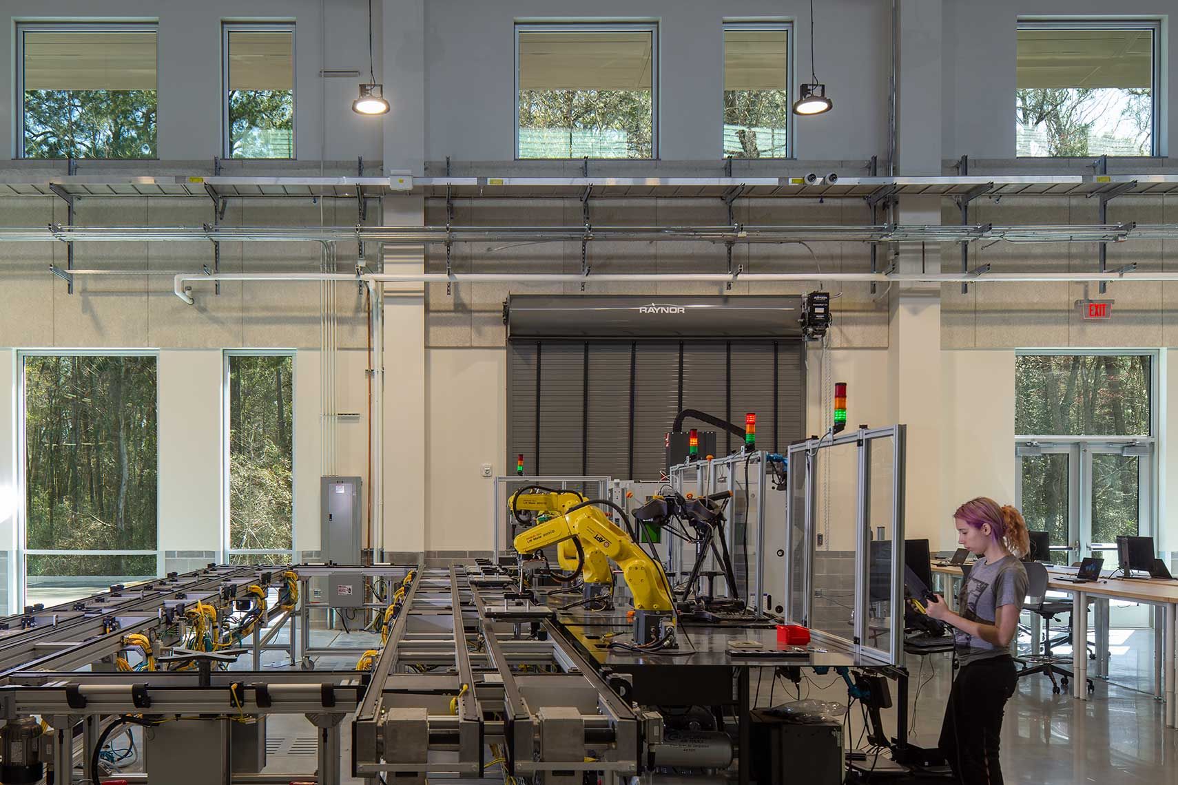 A view of a single student operating the robotic assembly machines at GA Southern