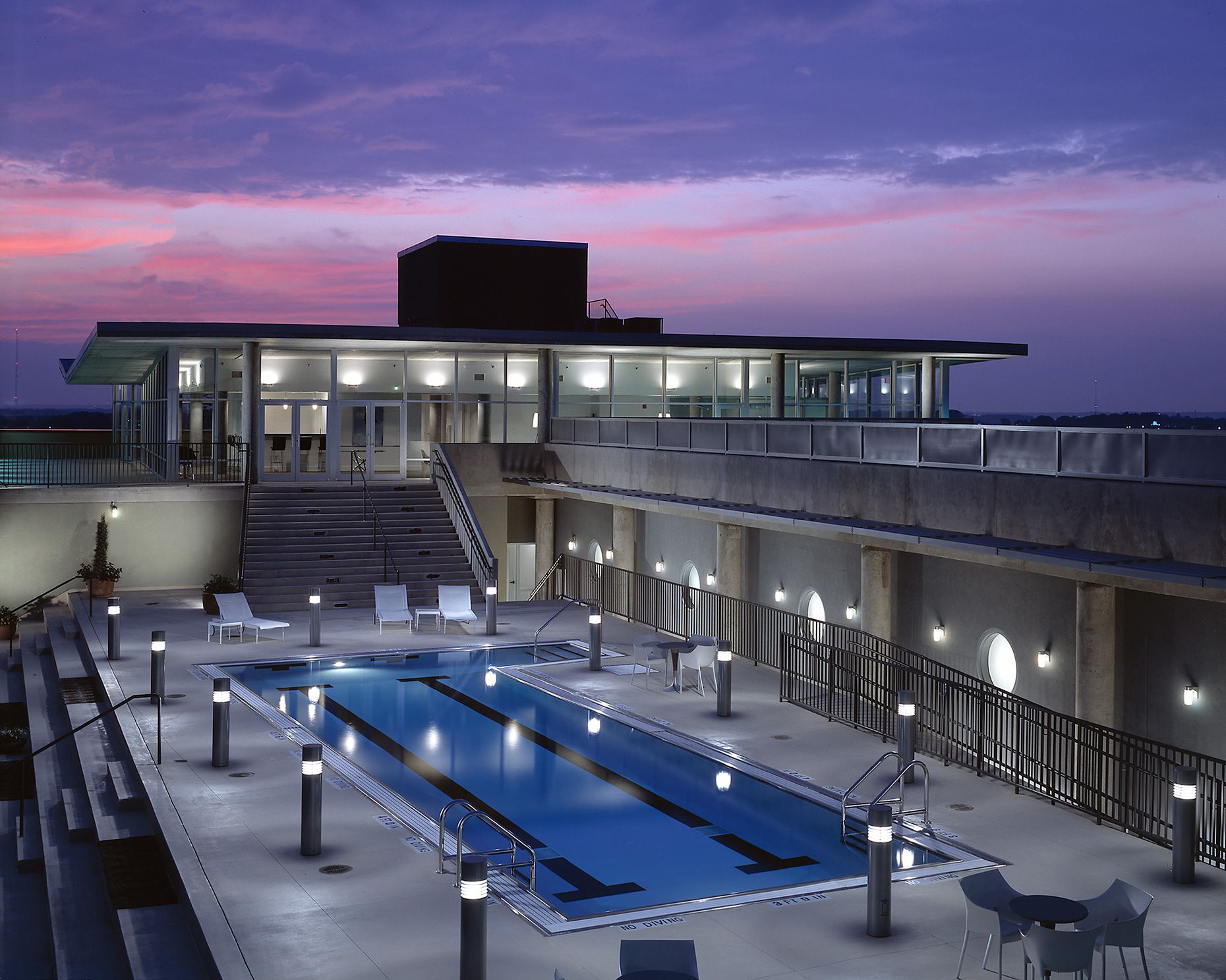 A nicely lighted rooftop pool at twilight at Mid-City Lofts in Atlanta, Georgia