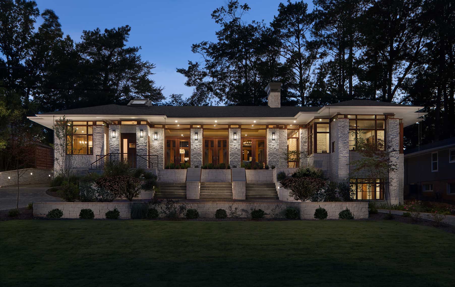Exterior view of Atlanta residence and its landscaping photographed at twilight