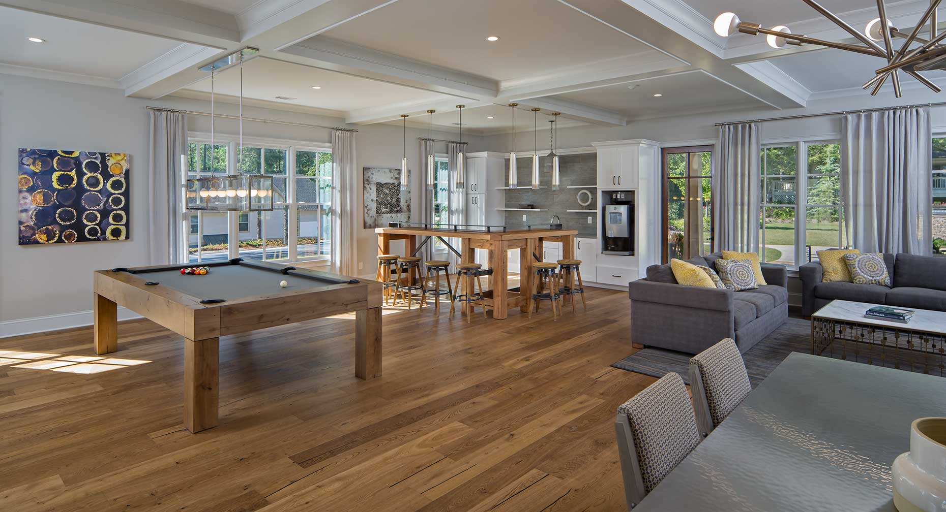 A sunlit interior view of the recreation room at the Forest Hills Apartment Community in Vinings, Georgia
